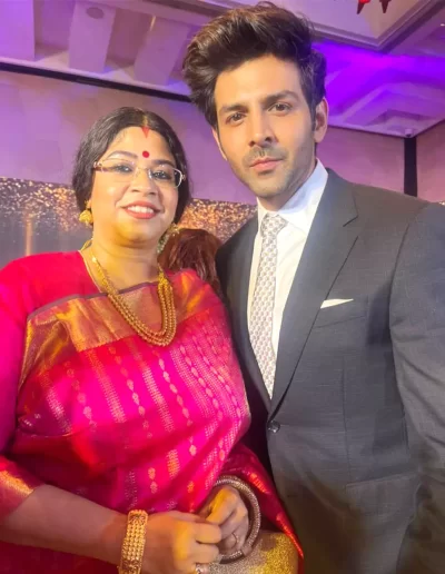 10. Dr. Sohini Sastri with Indian actor Kartik Aaryan at the Stardust awards ceremony.